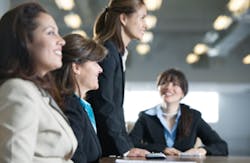 Four businesswomen in a meeting in the board room Four businesswomen in a meeting in the board room