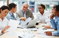 Business people discussing work on laptop at a meeting Business people discussing work on laptop at a meeting