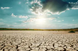 dramatic sunset over drought land