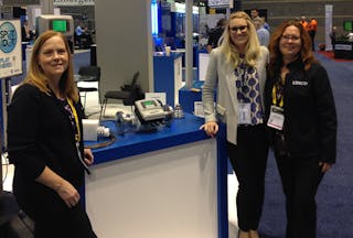 Blue-White&rsquo;s Shawn Yourd, center, with Editor Lori Ditoro, left, and Account Executive Lisa Williman, right, at WEFTEC 2015, during which many chemical and filtration treatment technologies were on display.