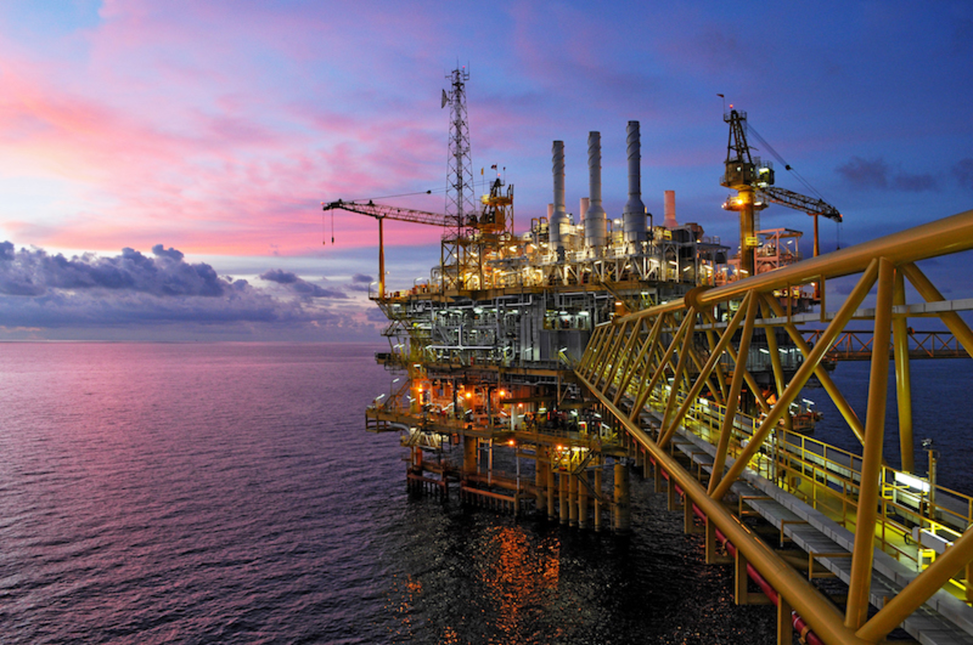 Offshore rig in twilight. Image courtesy of think4photop/iStock.