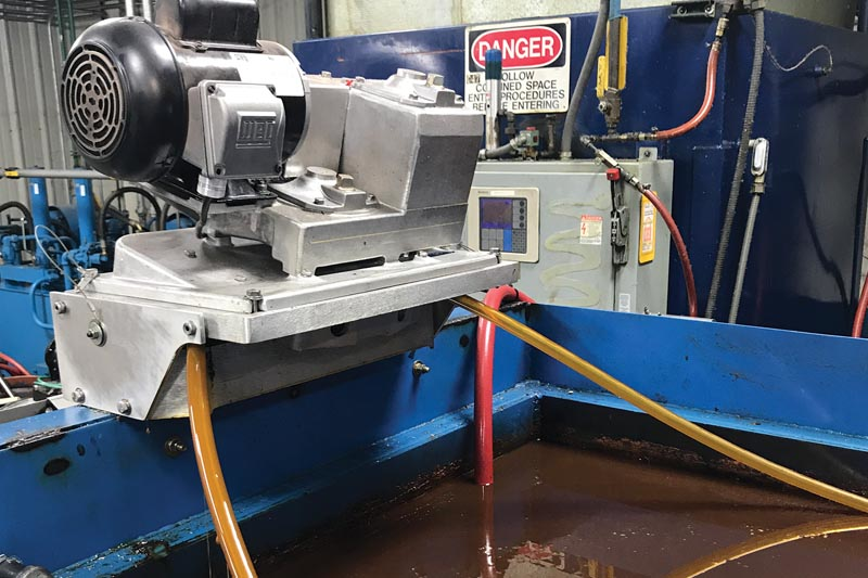 In a Separate and Skim Tank, a tube is drawn continuously across the water and floats on the surface, collecting only fats, oils and grease. The tube is scraped off by the skimmer and the clean tube returns to the surface to collect more FOG. All images courtesy of Oil Skimmers, Inc.