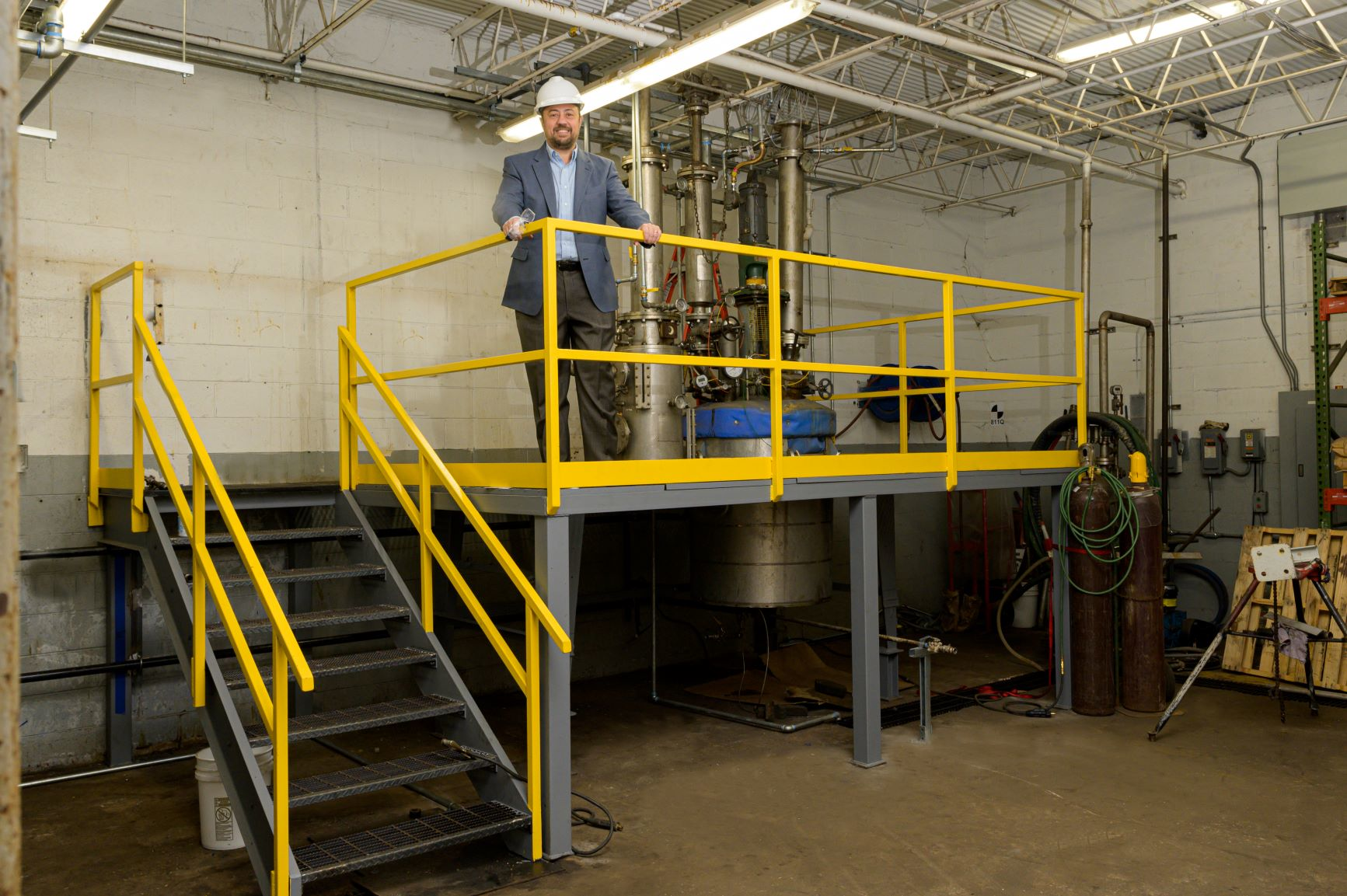 MFG Chemical Chief Science Officer Guido DeStefano inspects completion of pilot plant upgrade.