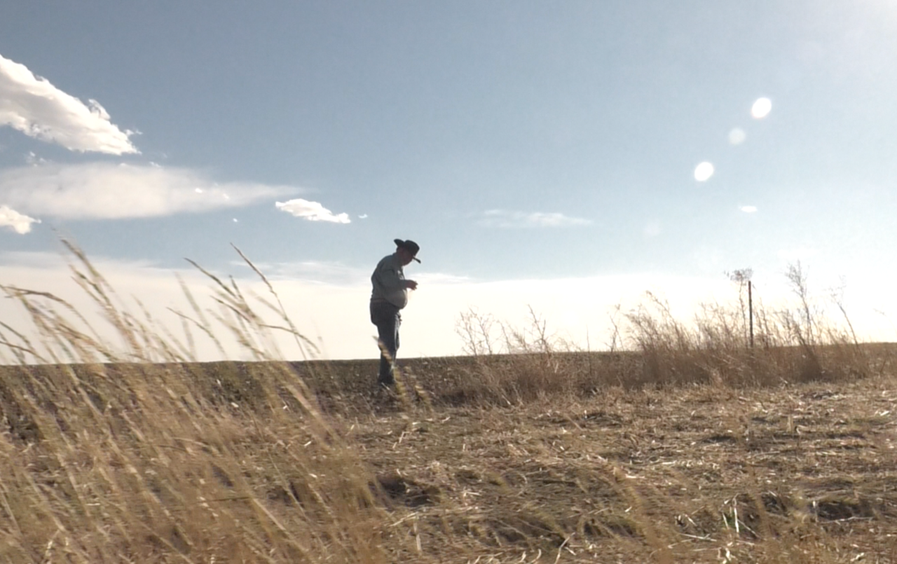 EGE co-founder Marvin Nash stands in a field in Wyoming.