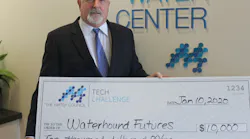 Tony Jones, Ph.D, of Waterhound Futures accepts a check.