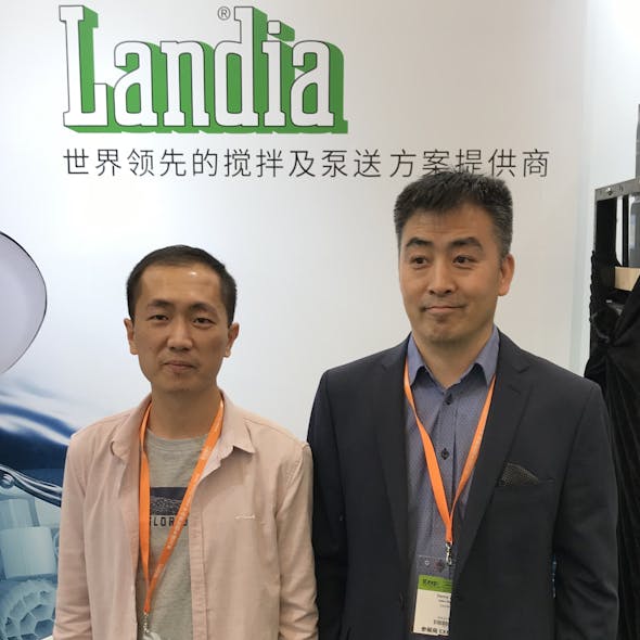 On with business. Landia&apos;s Danny Zhang (right) with key Landia customer, Mr. Chen from Huizhou.