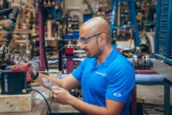 Aninda Sarker, Grundfos district sales manager, tests the Grundfos SMART Digital dosing pump for the Clean Works application. Aninda Sarker, Grundfos district sales manager, tests the Grundfos SMART Digital dosing pump for the Clean Works application.