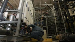 A Wrangler&circledR; engineer checks the reverse osmosis filtration system, an important step in the wastewater cleaning process.