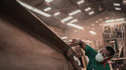 Manufacturing Man In Green T Shirt Holding A Tool 3637829 Pexels