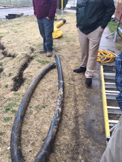 Three-inch suction hose removed from screen after sinkhole formed.