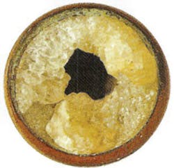 Figure 2. Boiler tube almost completely plugged with calcium carbonate. Figure 2. Boiler tube almost completely plugged with calcium carbonate.