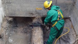 A George Gradel Co. worker uses the 701-A pneumatic ICS saw with PowerGrit pipe cutting chain. A George Gradel Co. worker uses the 701-A pneumatic ICS saw with PowerGrit pipe cutting chain.