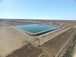 A containment pond at a fracking site. A containment pond at a fracking site.