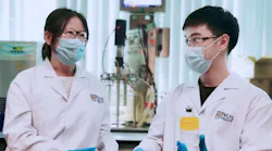 The team led by Associate Professor He Jianzhong (left) and Research Fellow Dr Wang Qingkun (right) discovered Thauera sp. strain SND5 after they isolated and tested various strains of bacteria from wastewater samples. Dr Wang holding a wastewater sample containing the unique SND5 bacterium.