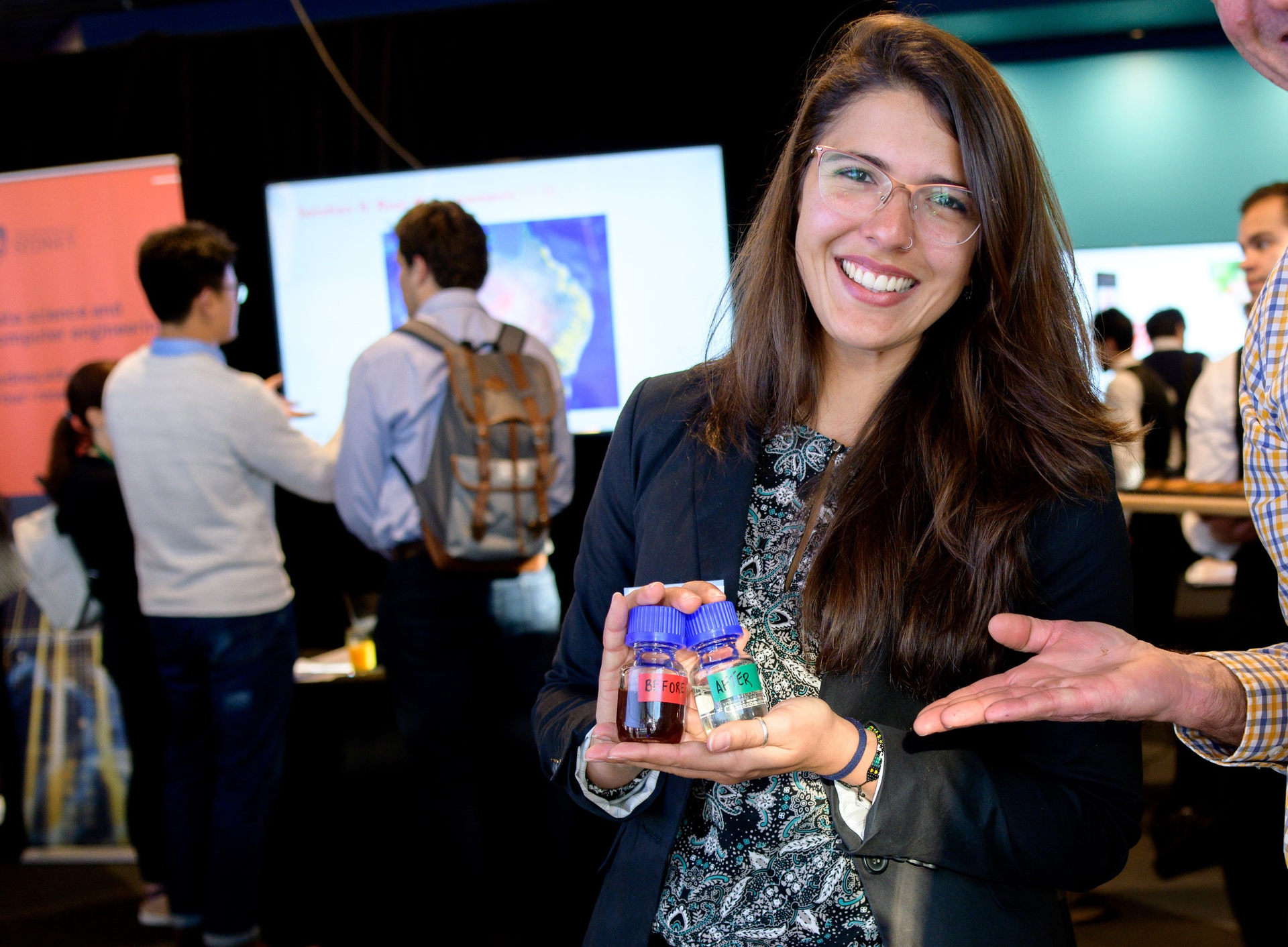 Julia Ciarlini Junger Soares showcasing her work at the University of Sydney. The researchers used an advanced oxidation process that eliminated stubborn organic aqueous pollutants.