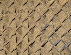 Figure 4a. Cross-fluted tower fill fouled with a slime and silt prior to peroxide cleaning. Figure 4a. Cross-fluted tower fill fouled with a slime and silt prior to peroxide cleaning.