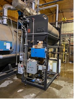 A feedwater tank/pump skid for a low-pressure firetube boiler.