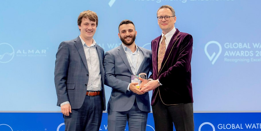 ZwitterCo's Christopher Drover, CTO & co-founder, and Alex Rappaport, CEO & co-founder, accept a Global Water Award from Christopher Gasson, owner of Global Water Intelligence Magazine and award ceremony host.