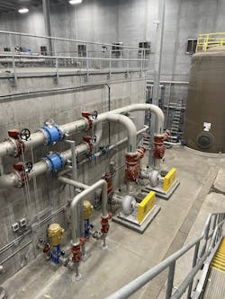 The large concrete tank is the membrane bioreactor. It separates clean water (final effluent) from biosolids. The pumps in the foreground are final effluent pumps that discharge clean water to the Big Sioux River and the water reuse pumps that allow Smithfield to reuse clean water in the wastewater treatment system. The large concrete tank is the membrane bioreactor. It separates clean water (final effluent) from biosolids. The pumps in the foreground are final effluent pumps that discharge clean water to the Big Sioux River and the water reuse pumps that allow Smithfield to reuse clean water in the wastewater treatment system.