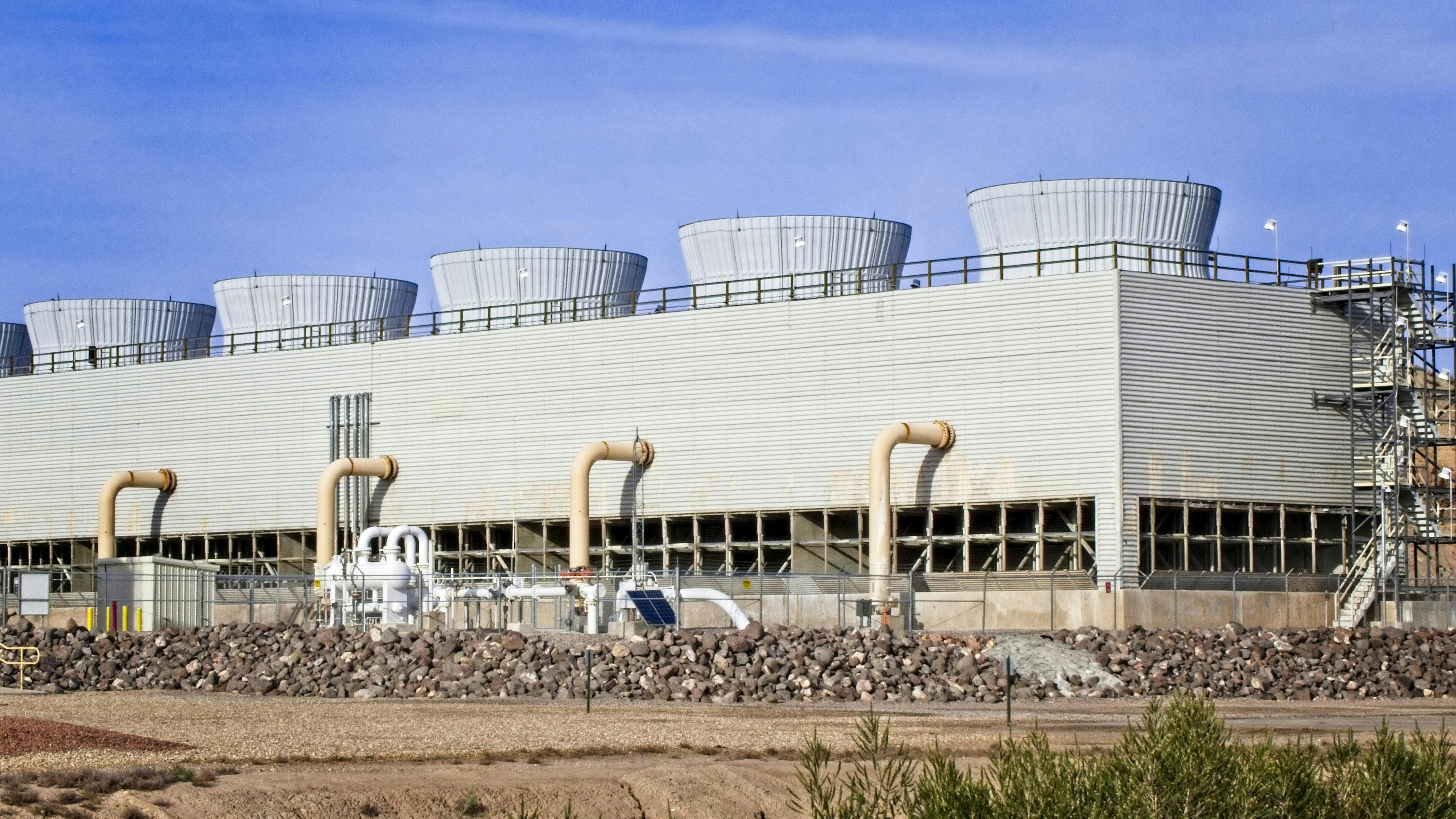 An array of cooling towers at a gas-fired electrical generating plant.