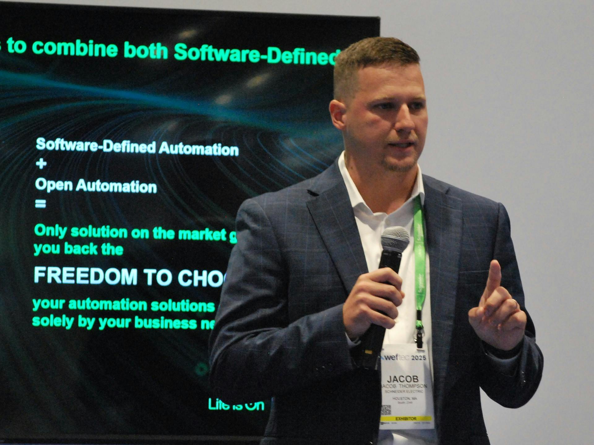 Schneider Electric's Jacob Thompson speaks during a presentation at WEFTEC 2025 in Chicago.