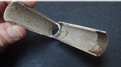 CaCO3 scale in an extracted and bisected heat exchanger tube.2 CaCO3 scale in an extracted and bisected heat exchanger tube.2