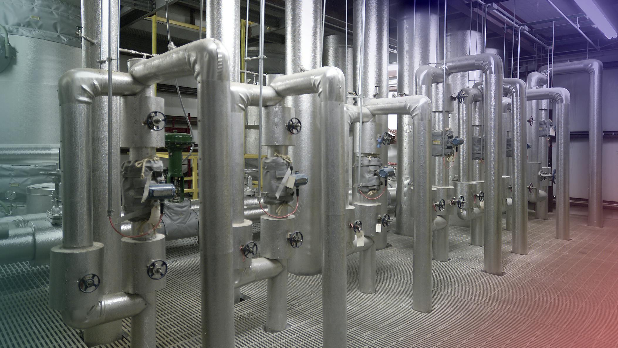Various metal pipes and shut off valves in water treatment facility