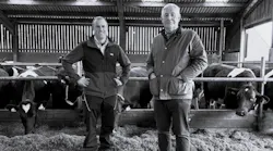 Richard Greaves, farm manager, and Adrian Fenton, managing director, for Yeo Valley Farms Ltd. stand in front of their dairy cows in England.